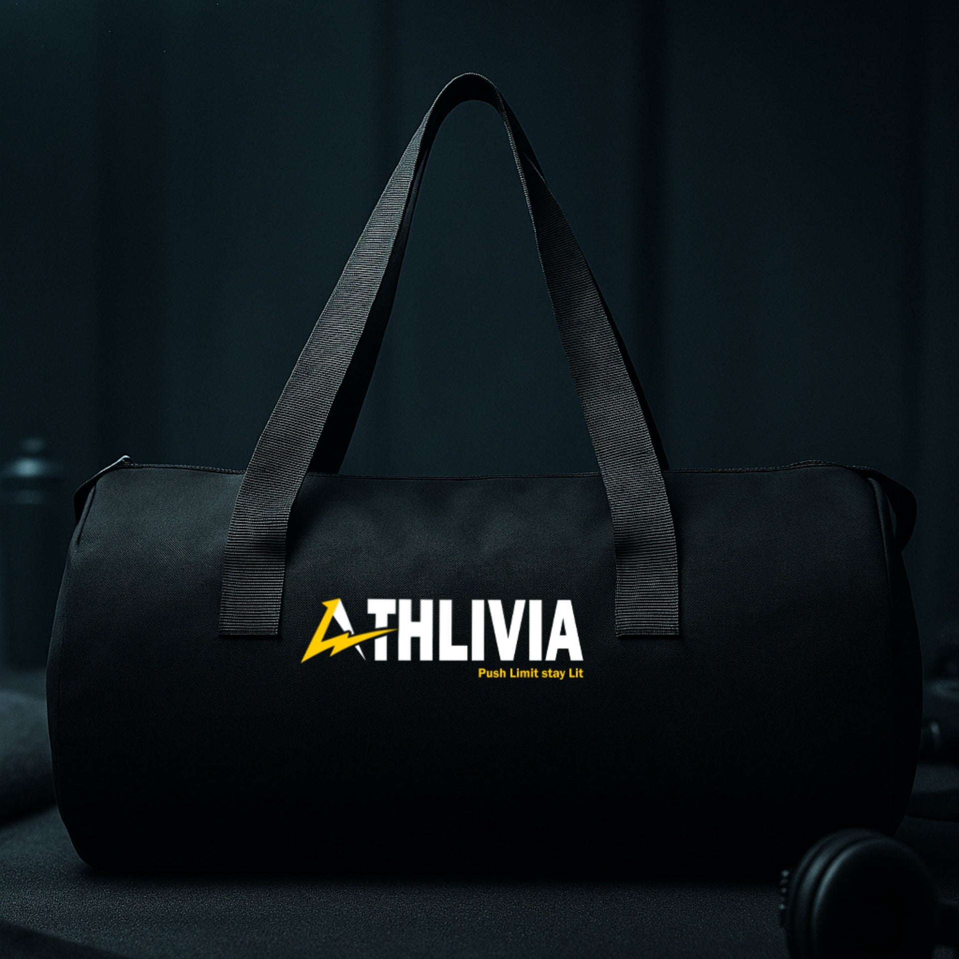 Black duffel bag with 'ATHLIVIA' logo on a dark background